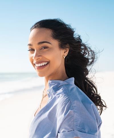smiling young woman on beach